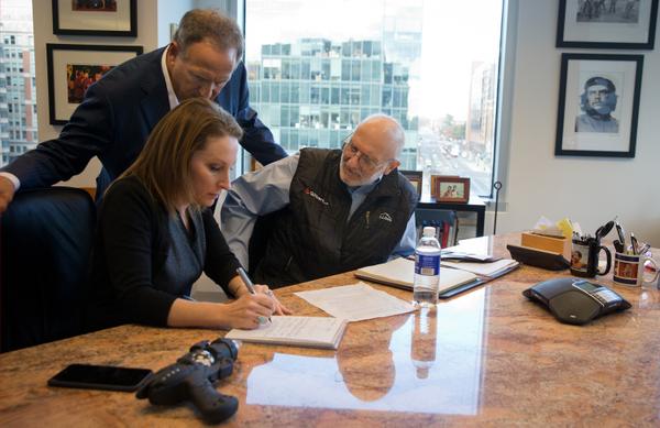 Alan Gross, w atty Scott Gilbert & spokeswoman Jill Zuckman, prepping remarks to deliver after arriving in US
